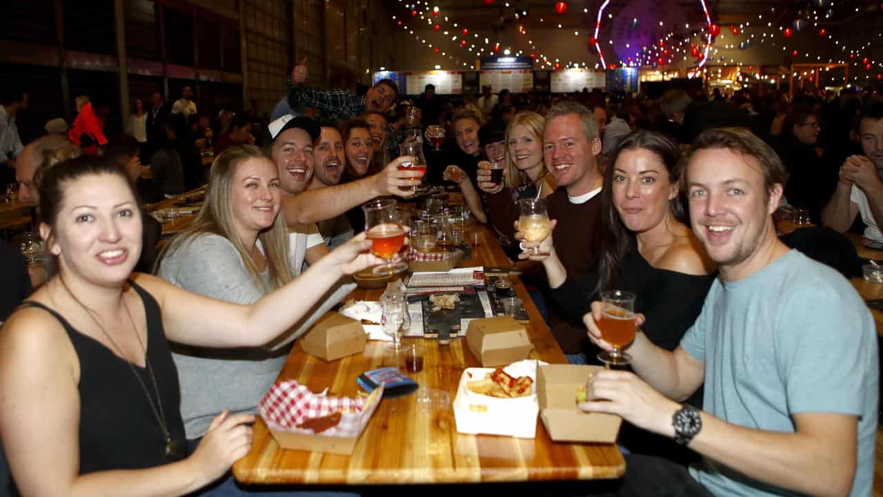 People enjoy meals and beer at the Gabs Beer Festival in Sydney