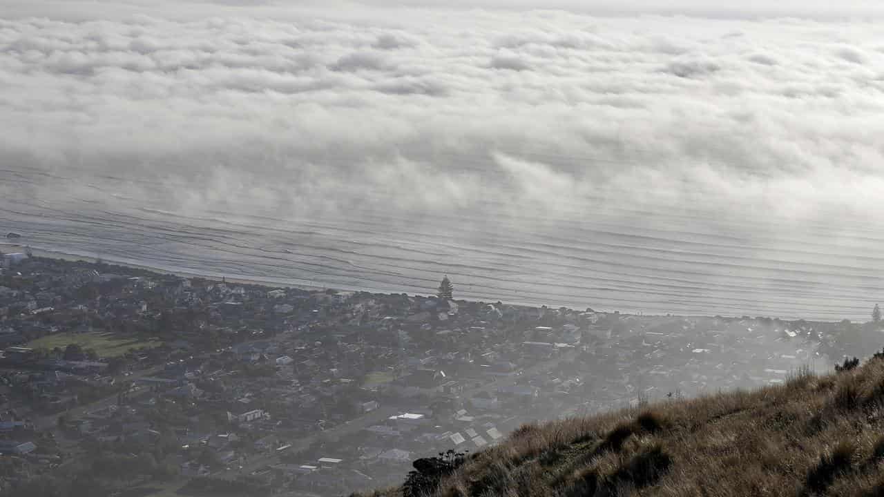 A photo of heavy clouds over Sumner Beach near Christchurch, NZ.