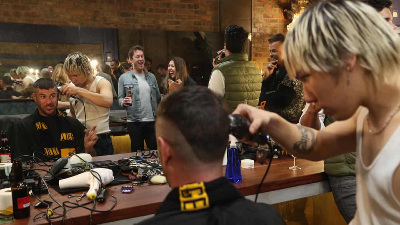 Richmond fan getting a 'Dusty' Martin haircut.