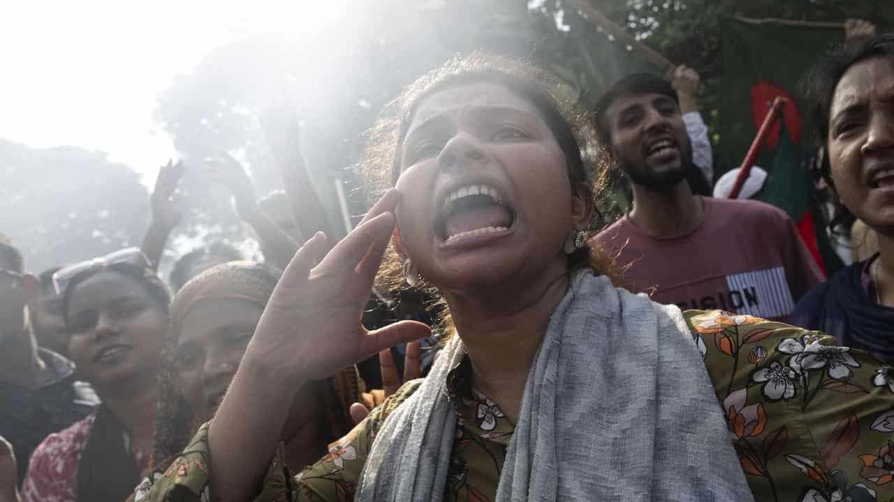 Protesters celebrate Sheikh Hasina's resignation, in Dhaka, Bangladesh