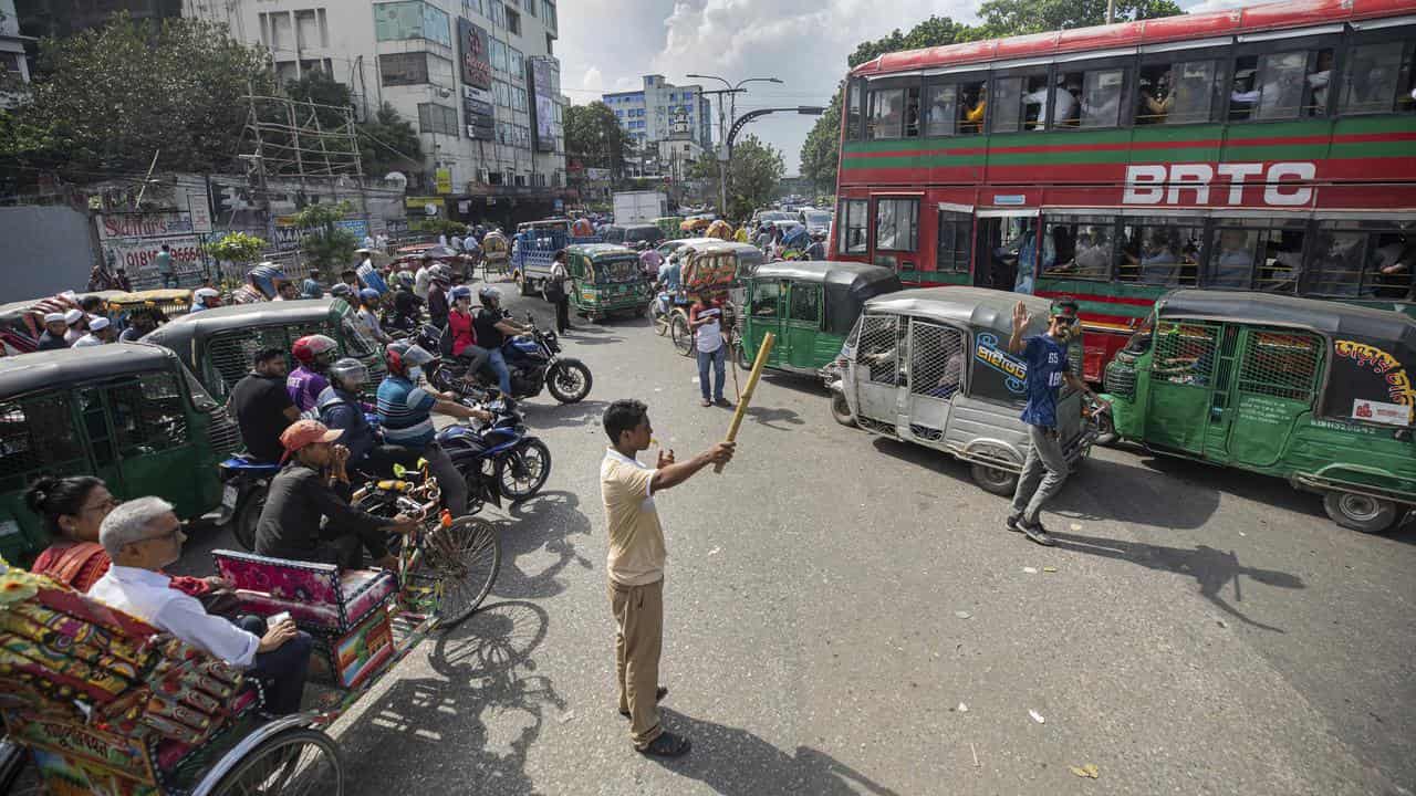 Volunteers manage road traffic in Dhaka, Bangladesh