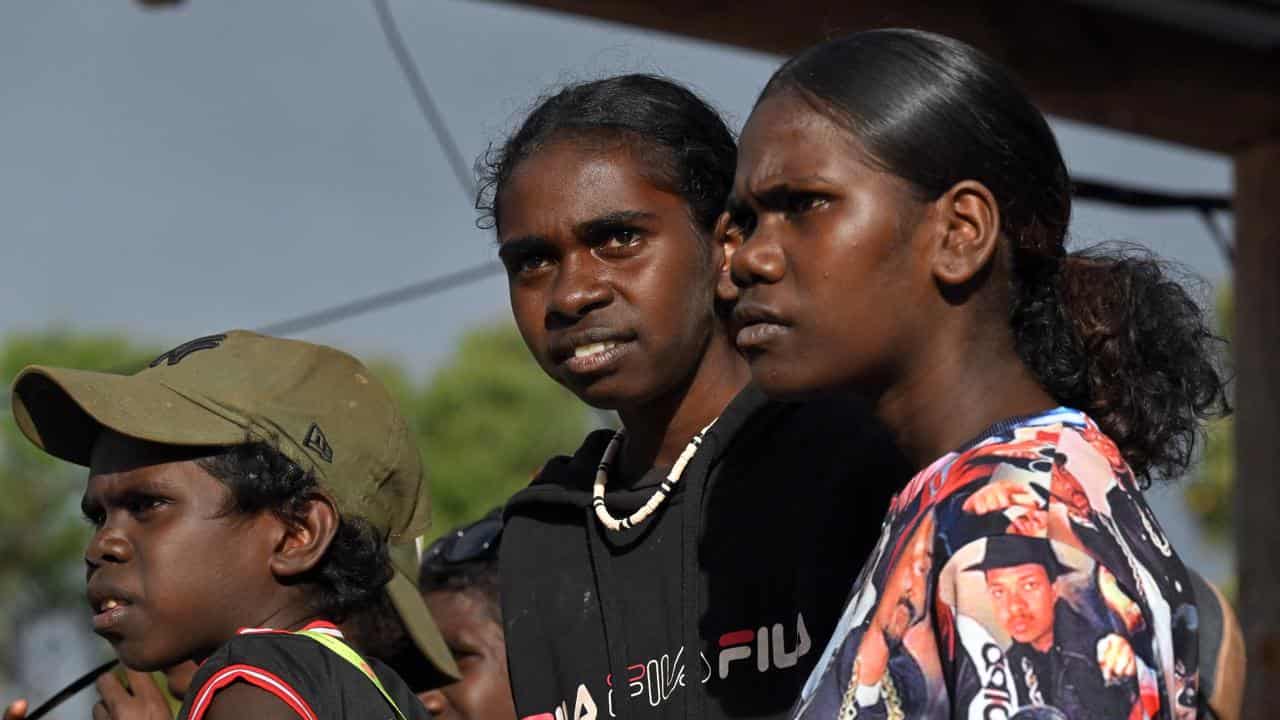 Indigenous youth watch the bunggul traditional dance