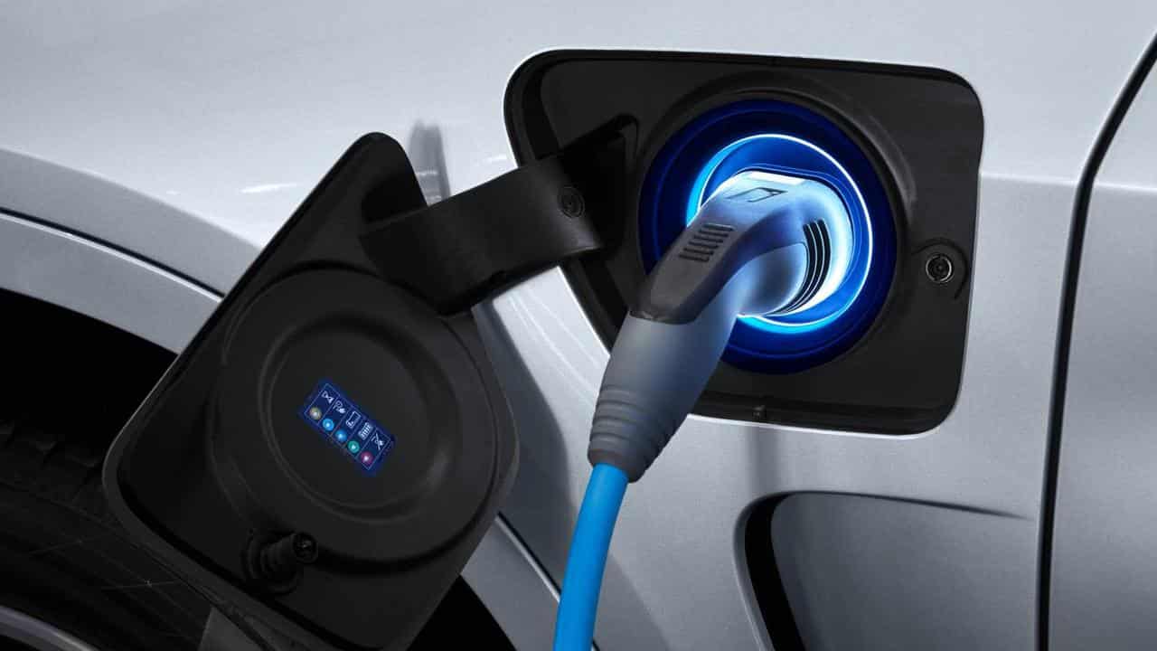 A hybrid car being charged