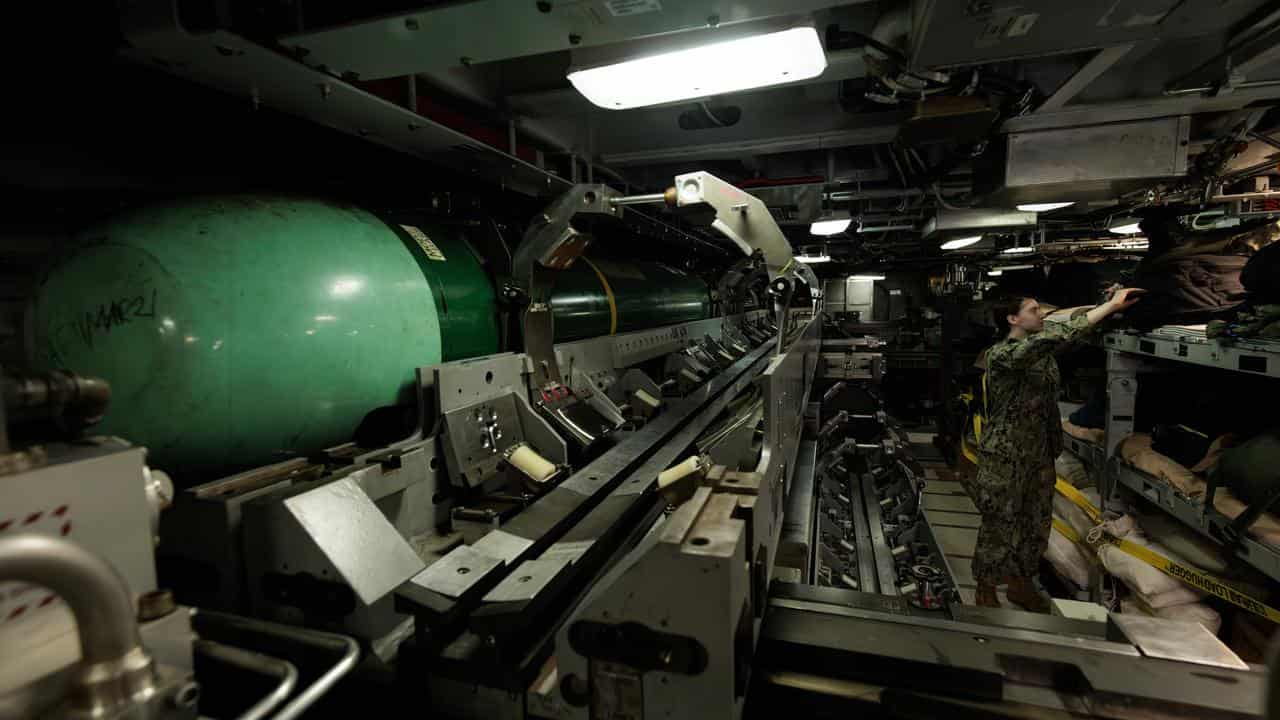 Crew member inside the submarine USS North Carolina