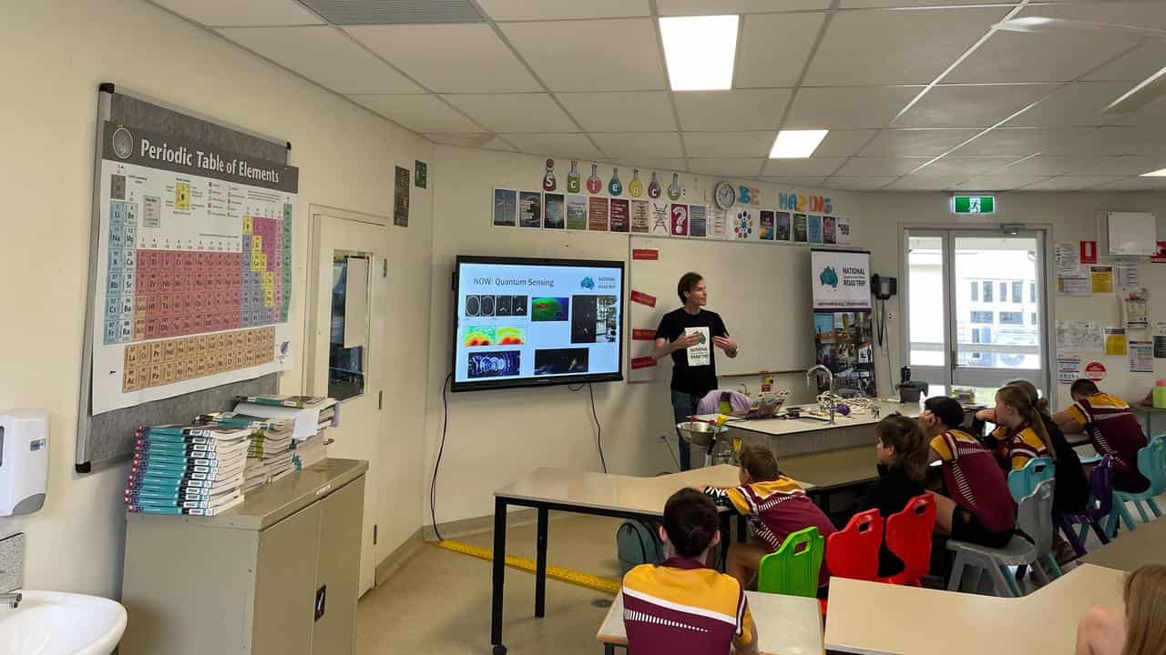 A scientist speaks to students at Clermont, Queensland.