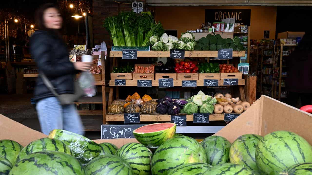 Members of the public shopping for fresh produce