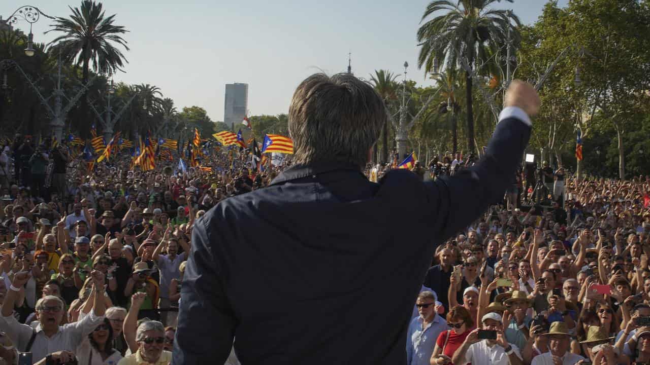 Carles Puigdemont addresses supporters in Barcelona