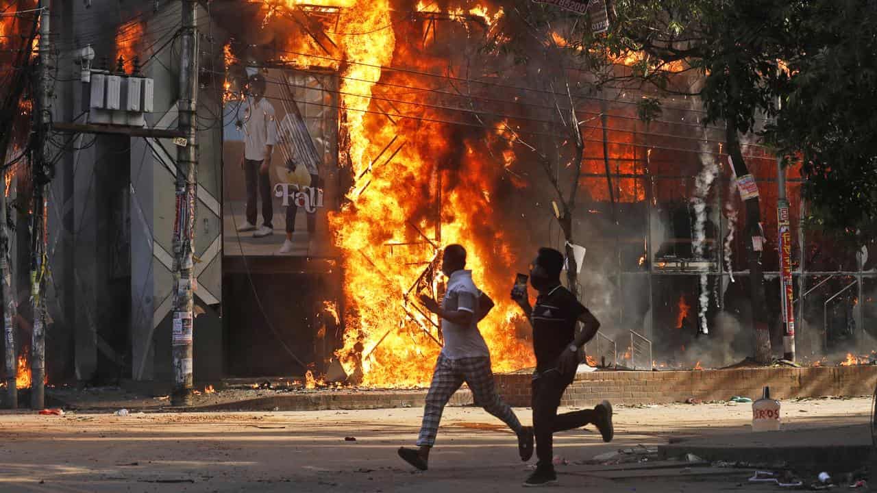 A shopping centre burns during anti-government protests in Bangladesh