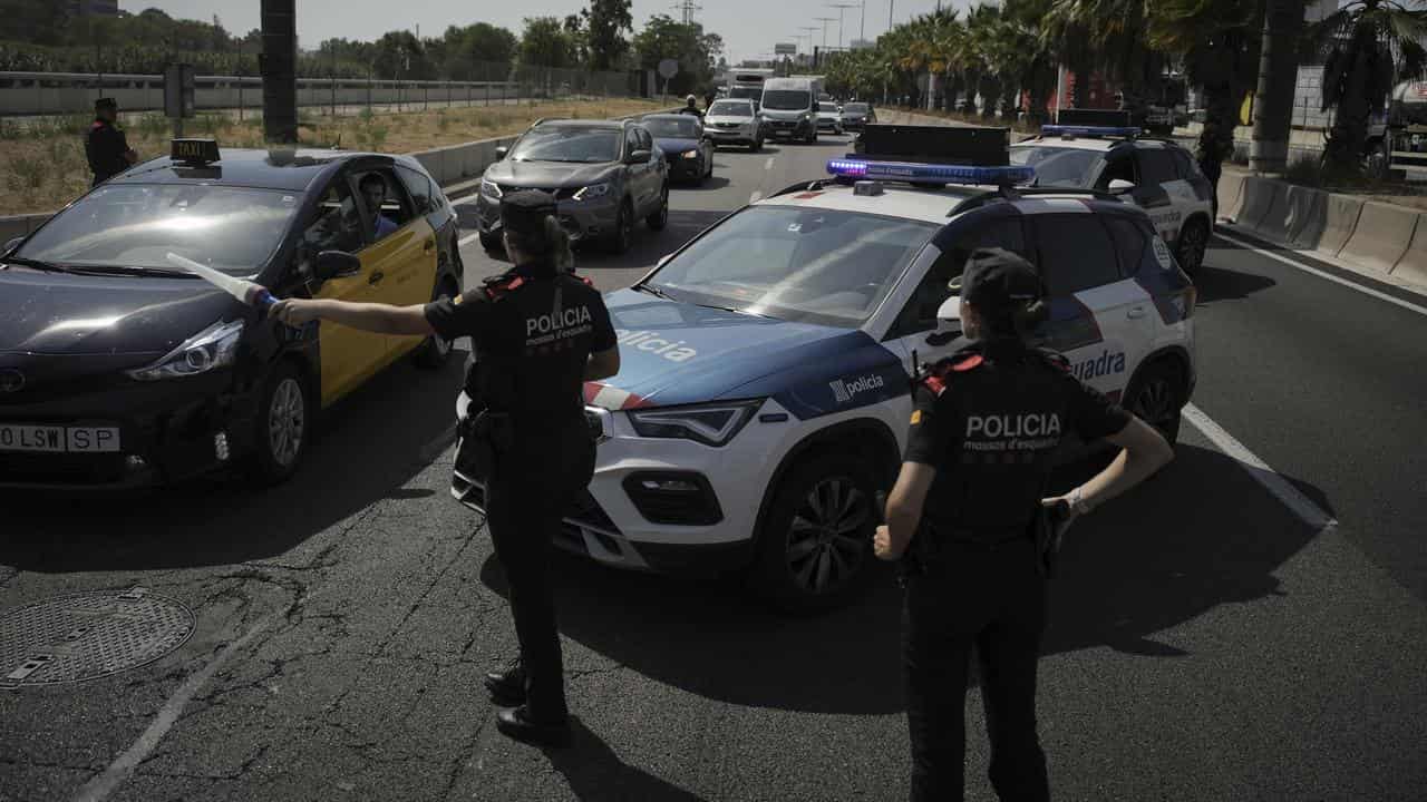 Catalan police at a checkpoint in the outskirts of Barcelona