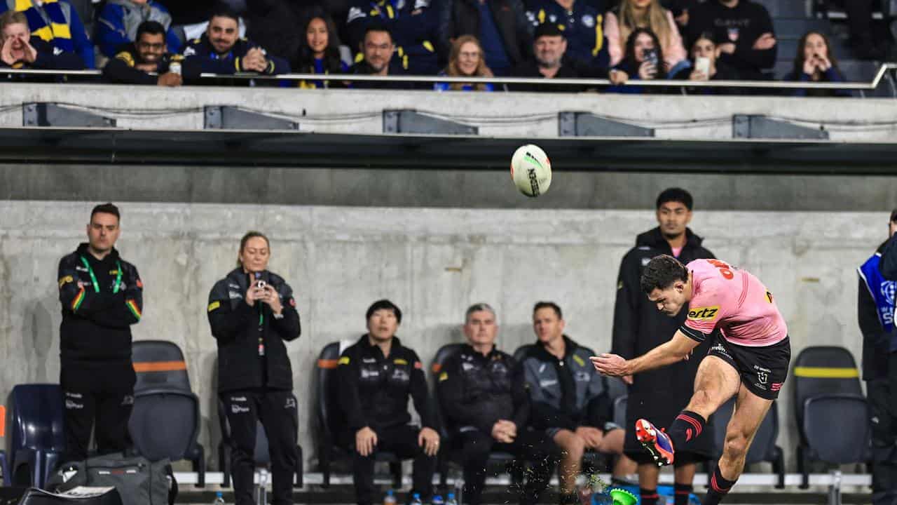 Ivan Cleary kicks a conversion.