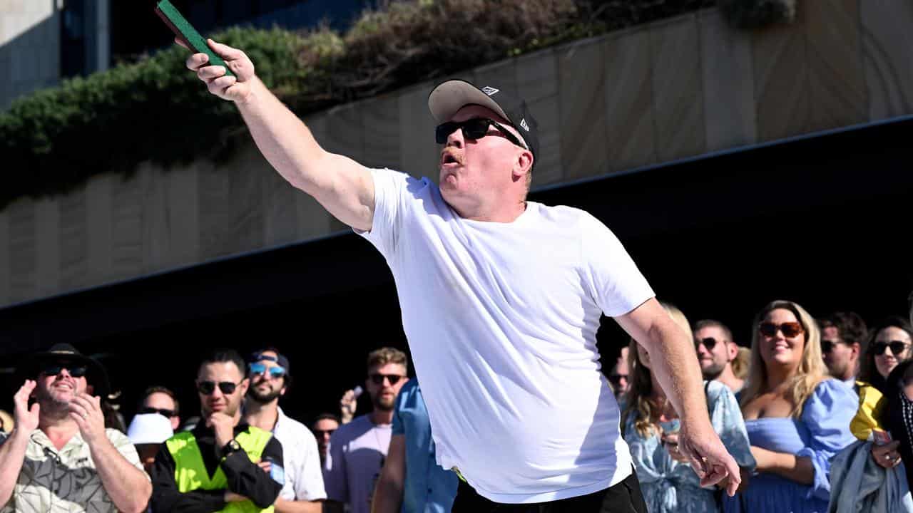 A crowdplaying two-up during ANZAC Day at Harbord Diggers