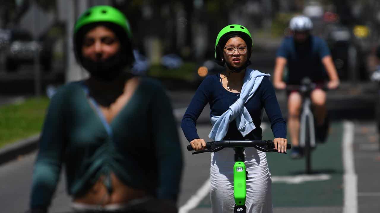 People riding Lime e-scooters (file image)