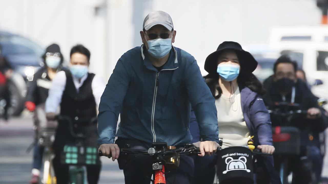 People wearing face mask are seen in Beijing, China