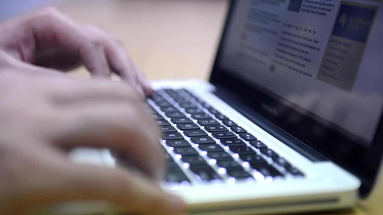 A man uses a laptop computer