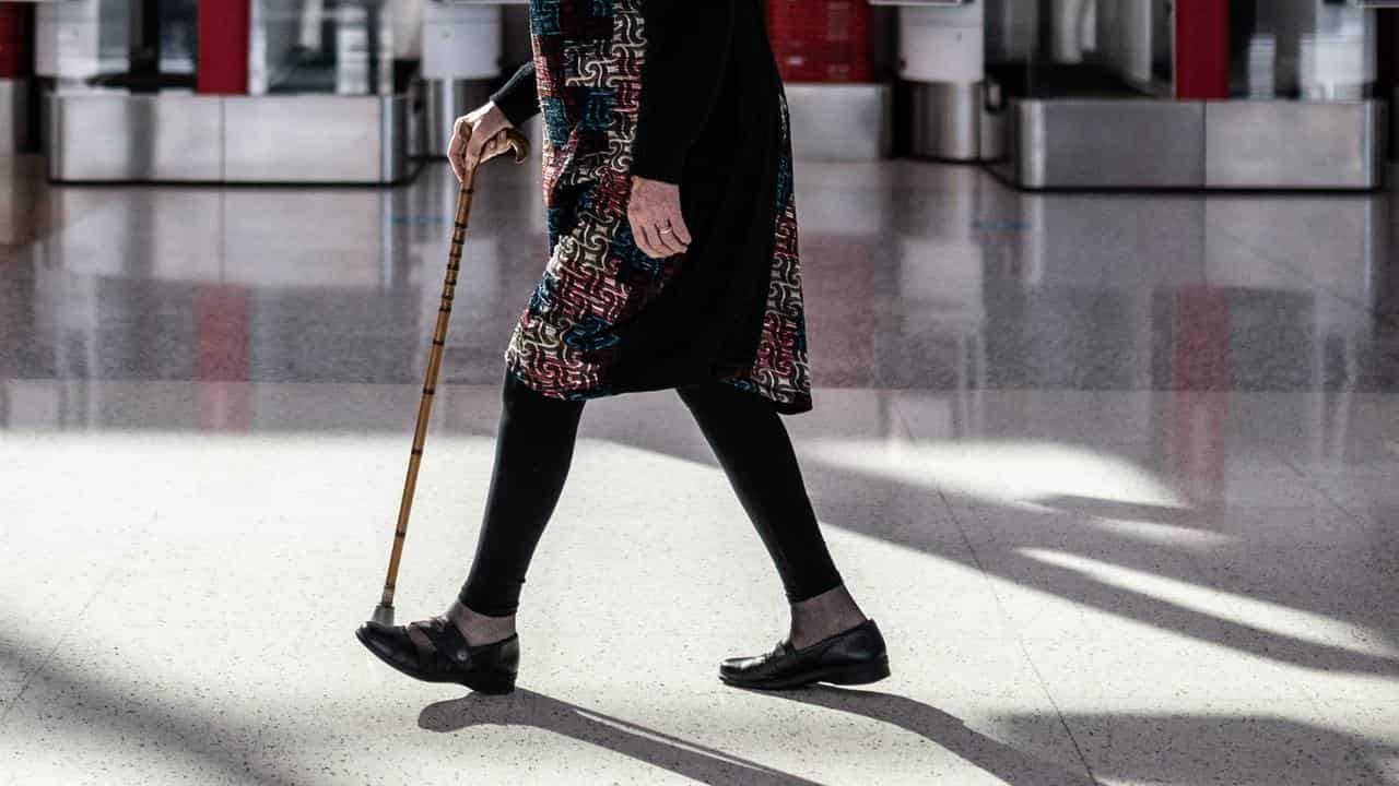 Woman with walking stick