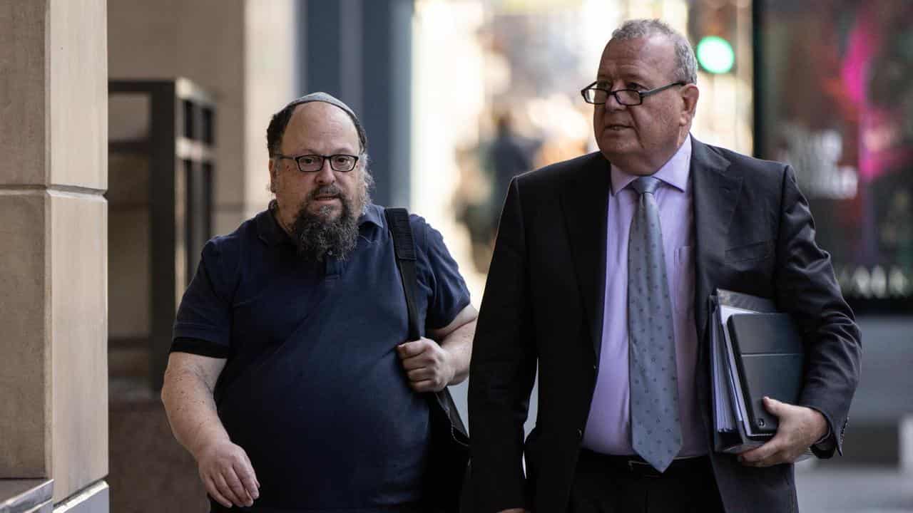 Zev Serebryanski (left) arrives at the Melbourne Magistrates' Court