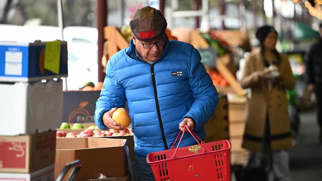 Man shopping for vegies nad fruit