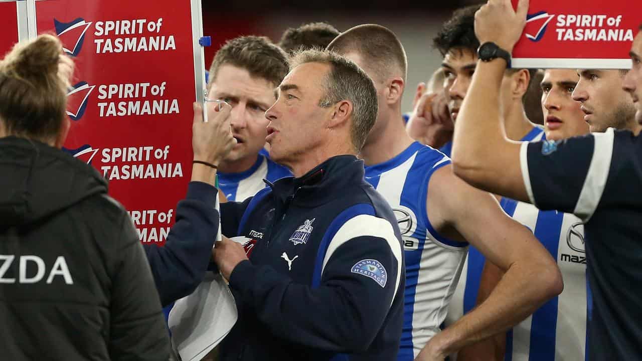 North Melbourne coach Alastair Clarkson (centre).