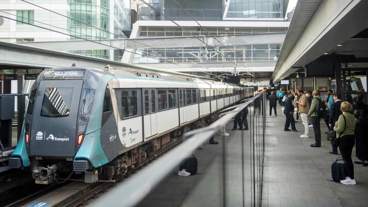 Passengers await a train at Chatswood Metro station in Sydney.