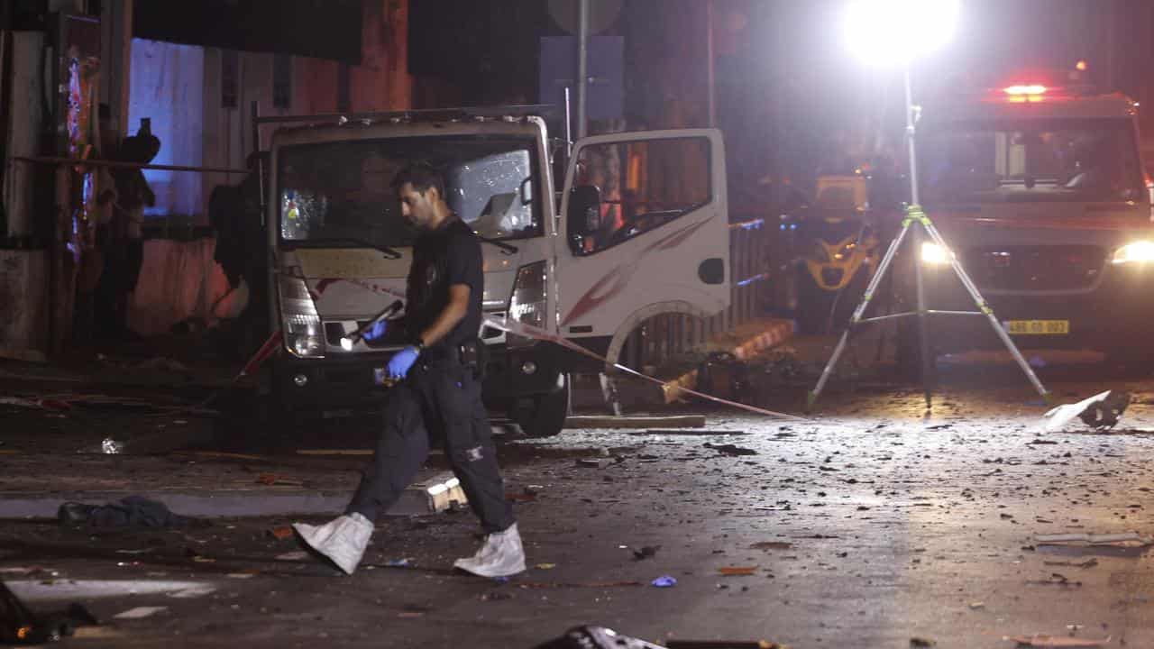 Israeli police work at the scene of a bombing in Tel Aviv, Israel