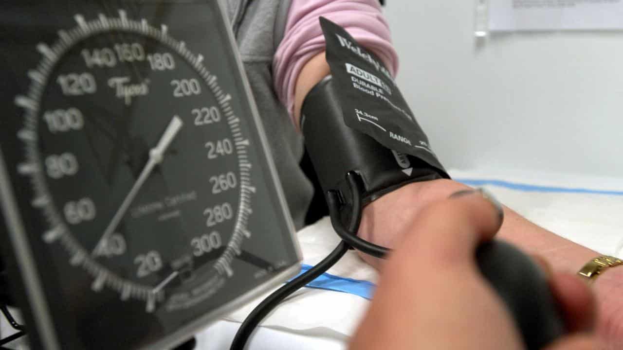 A person has their blood pressure checked (file image)