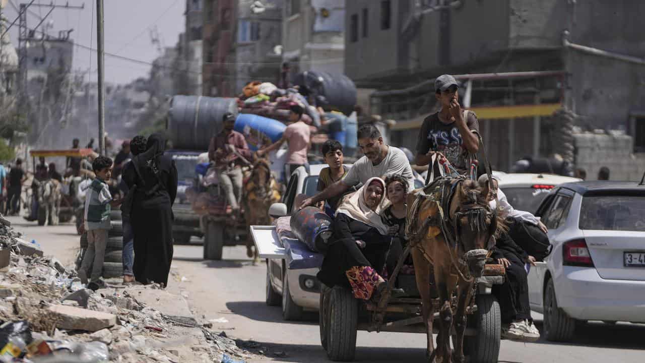 Palestinians flee Maghazi refugee camp in the central Gaza Strip