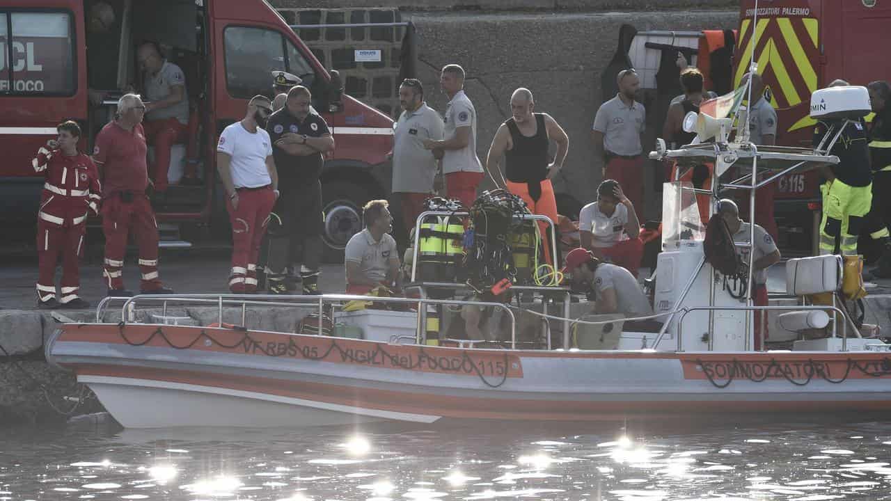 Scuba divers are docked at the harbor of Porticello, southern Italy