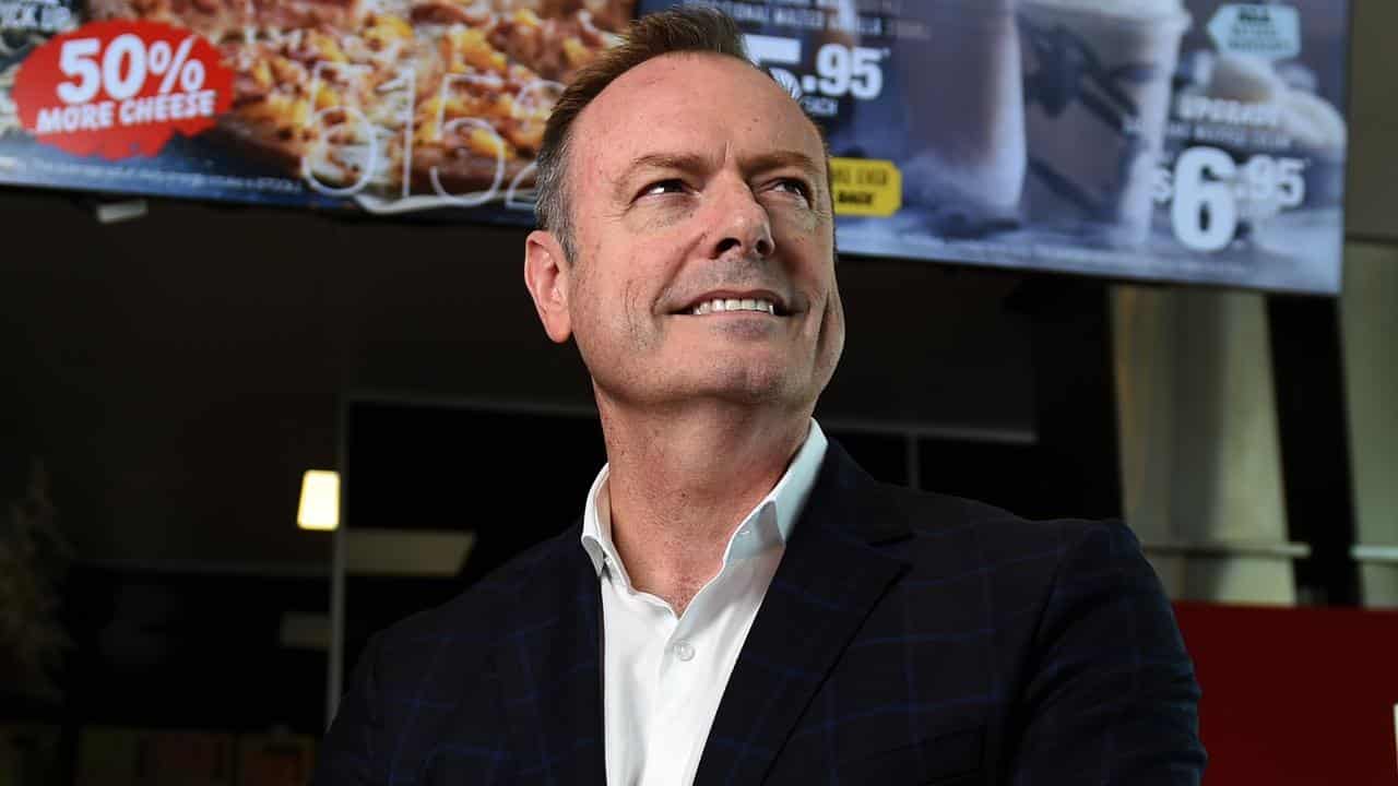 Don Meij in a Domino's shop.