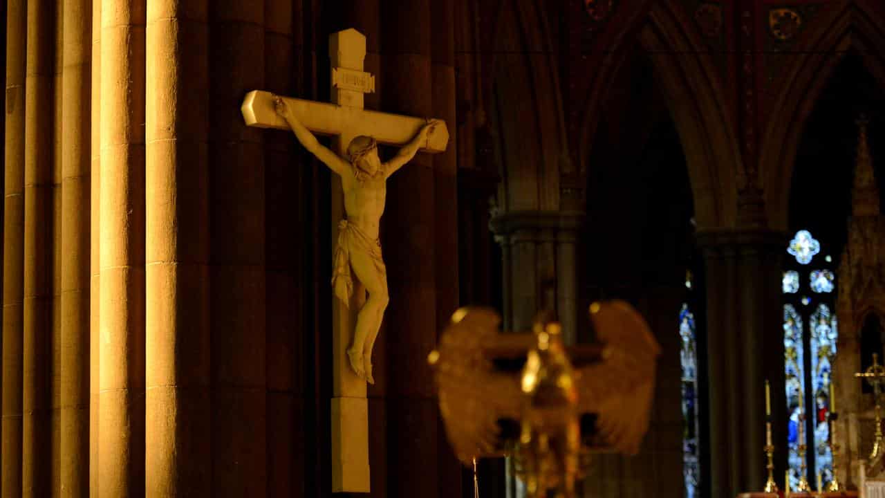 An image of Jesus crucified on a cross in a church.