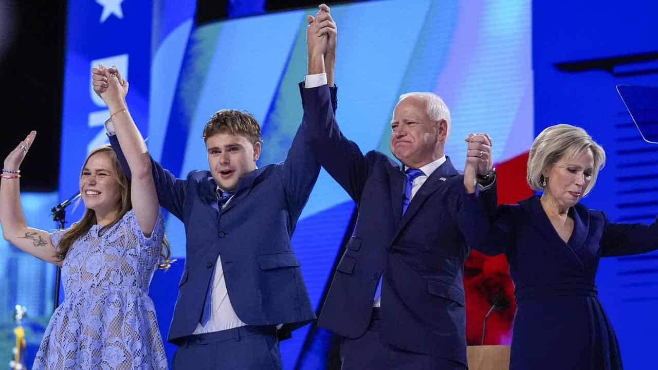 Tim Walz celebrates with his family at the DNC in Chicago