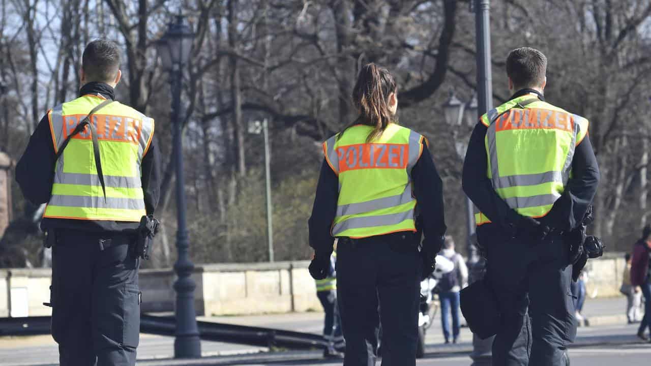 Three German police in Berlin.