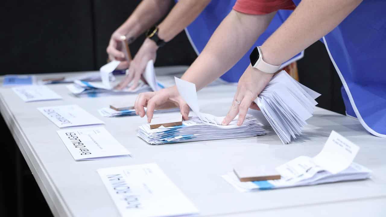 Officials count ballots in Darwin