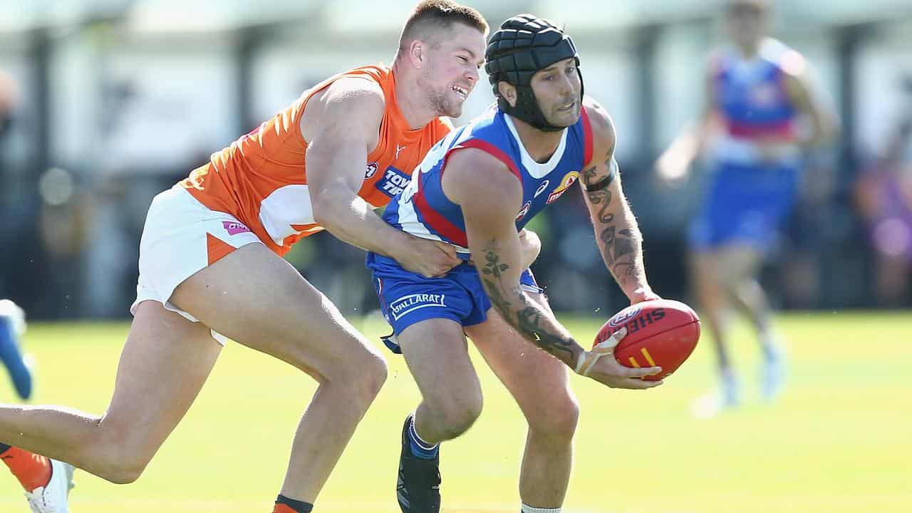 The Bulldogs' Caleb Daniel (right).