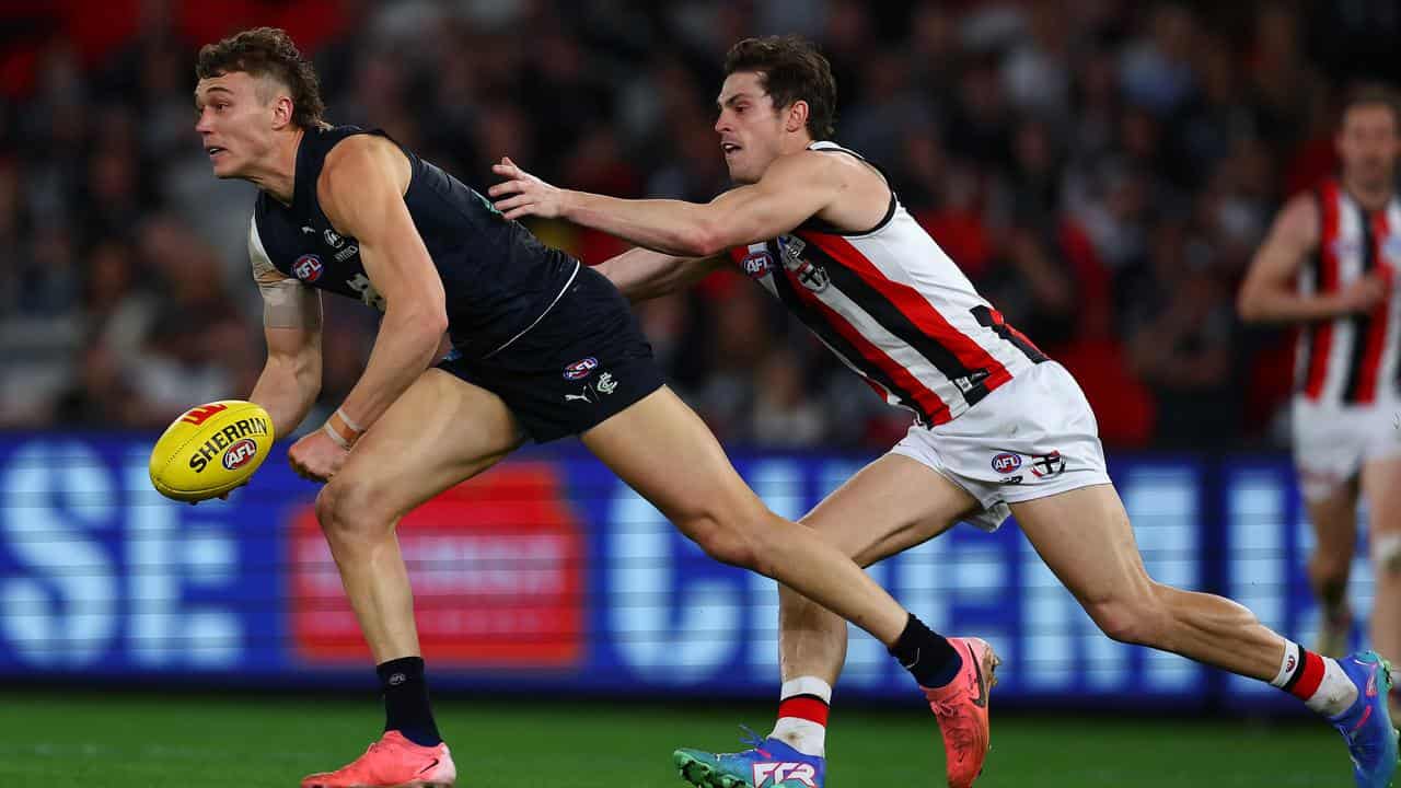 Carlton captain Patrick Cripps (left).