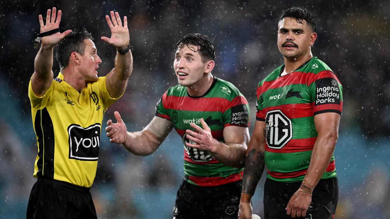 Referee Adam Gee, Cameron Murray and Latrell Mitchell.