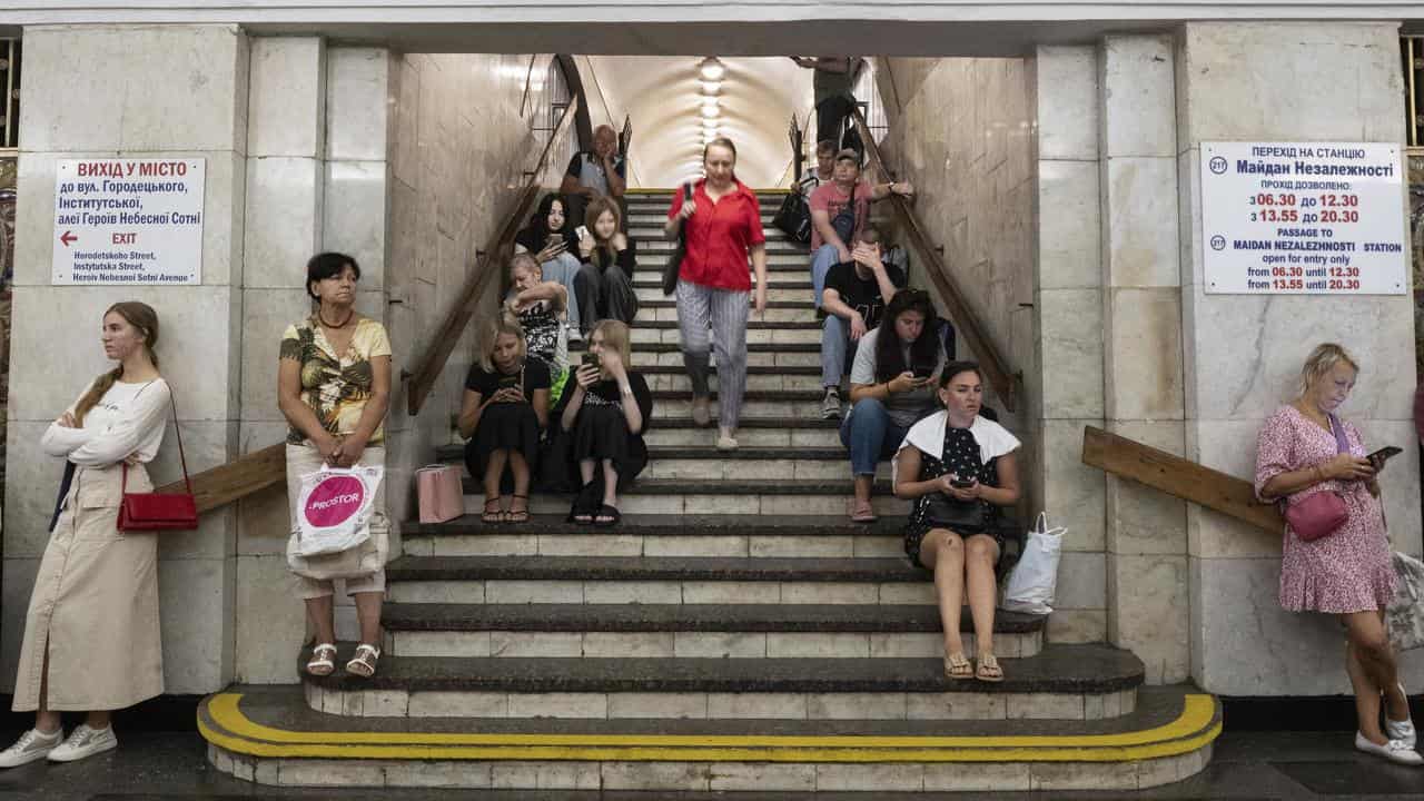 People take shelter from shelling at a metro station in Kyiv