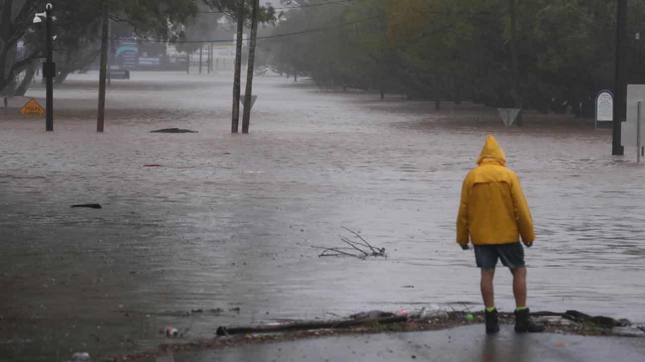 Man views flooding in Lismore in 2022