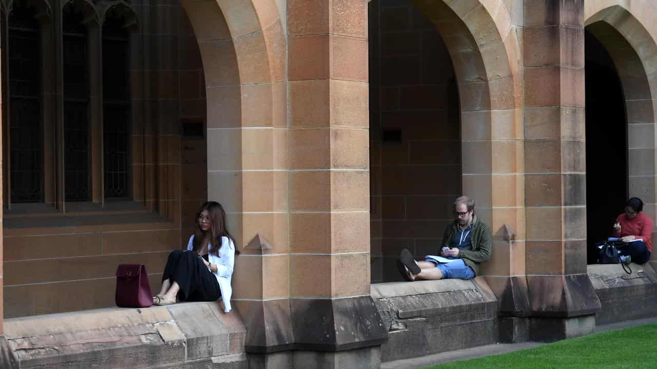 Students read at the Quadrangle of the University of Sydney