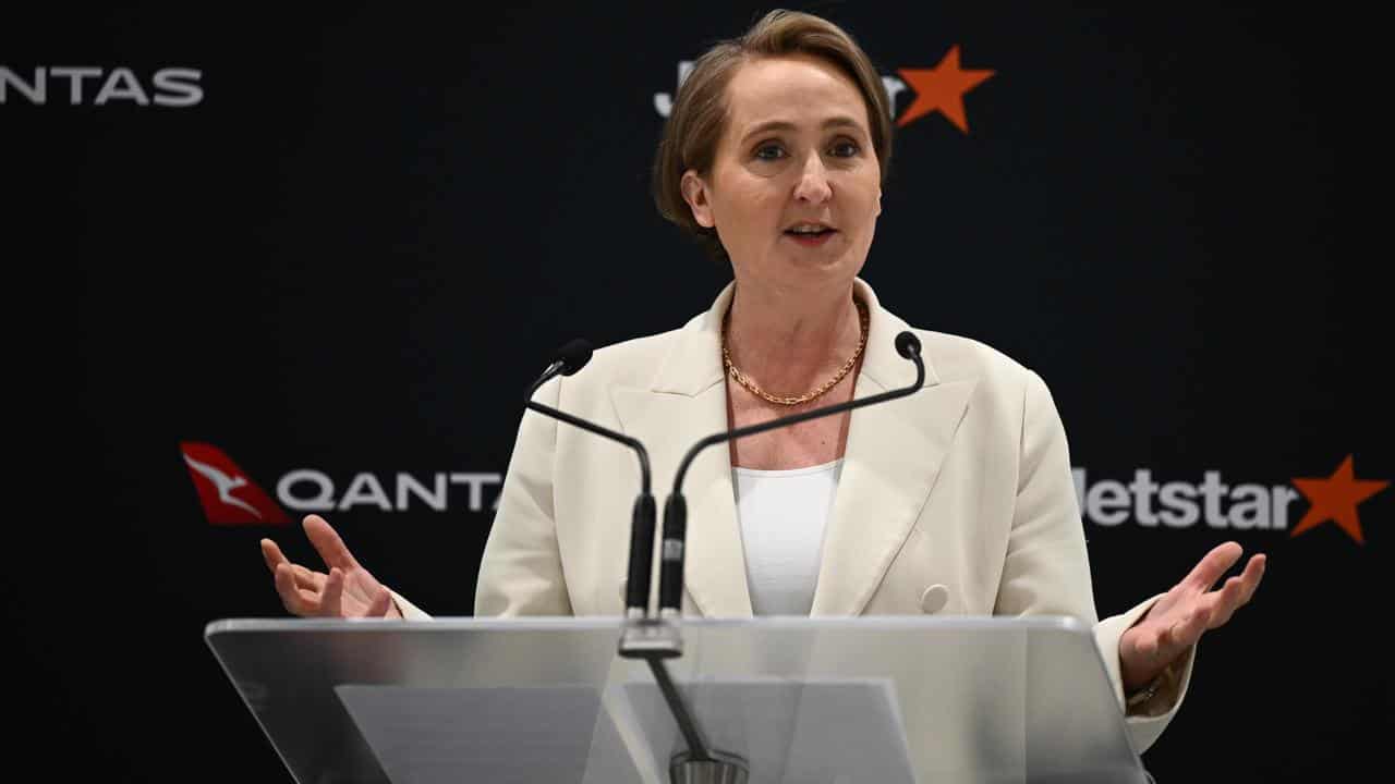 A woman at a lectern.