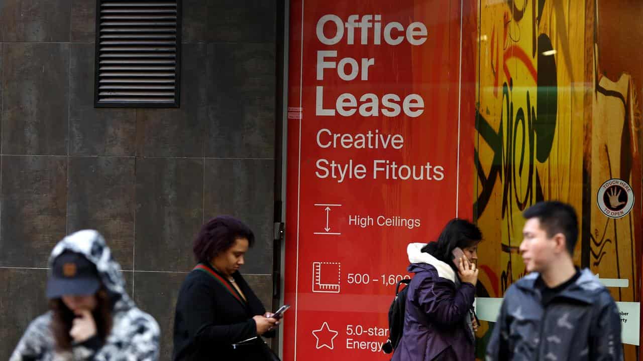 People are seen along Bourke Street in Melbourne,