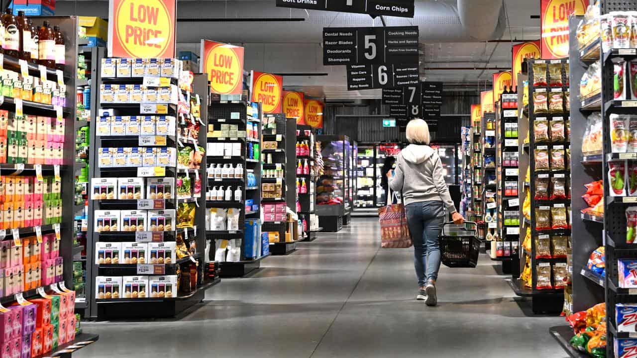 A woman shopping in a supermarket.