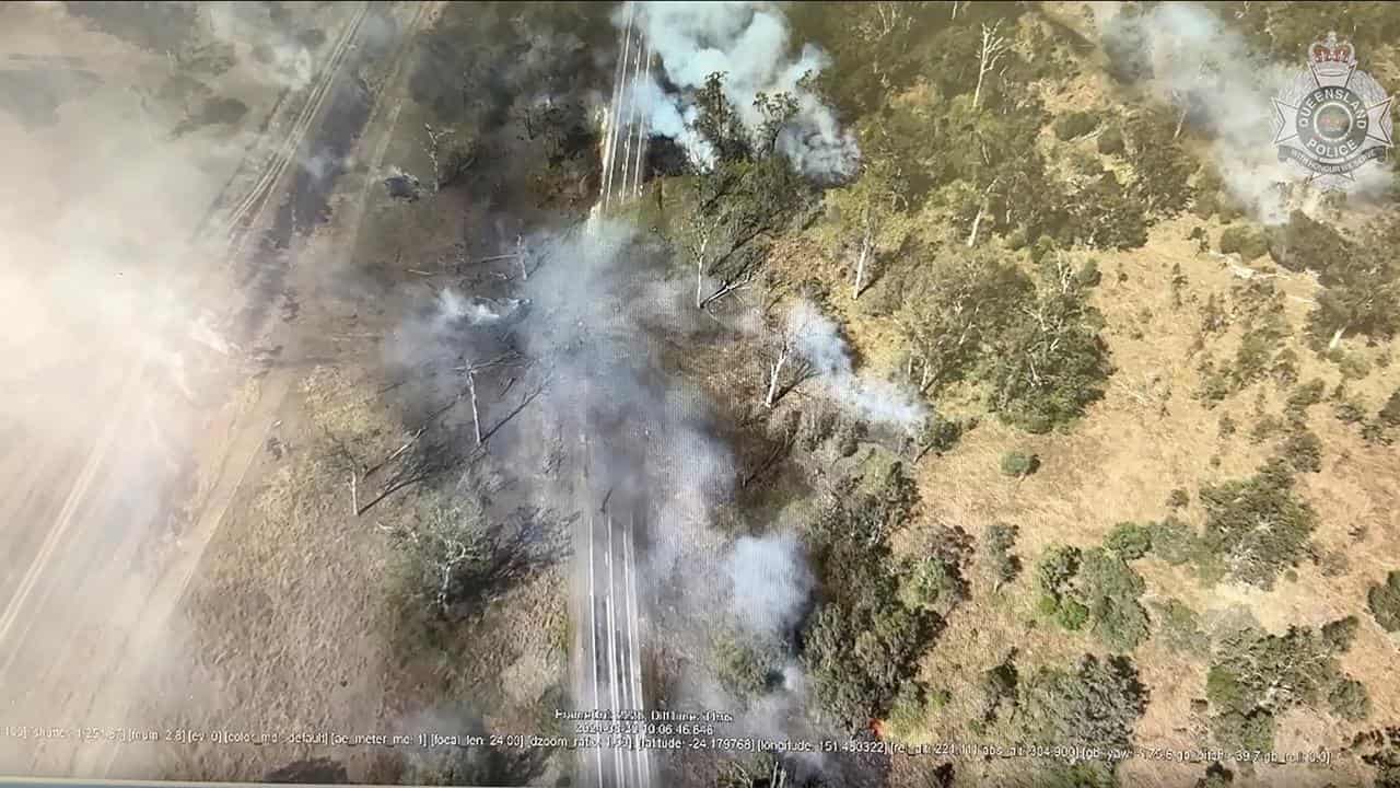 Smoke billows from a crash site.