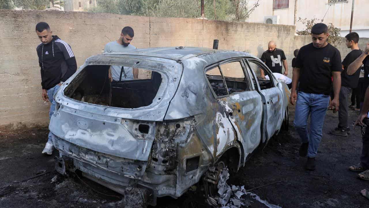 A car destroyed by an air strike in Al Zababda village, West Bank