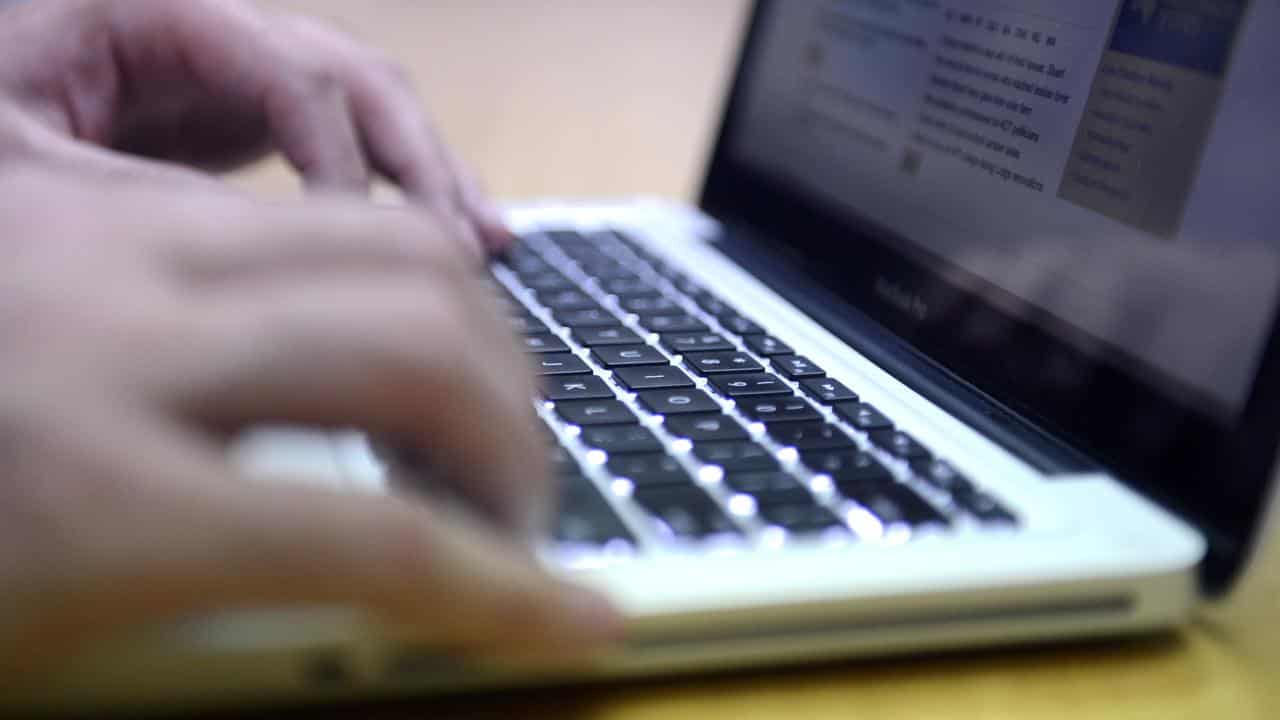 A man uses a laptop computer