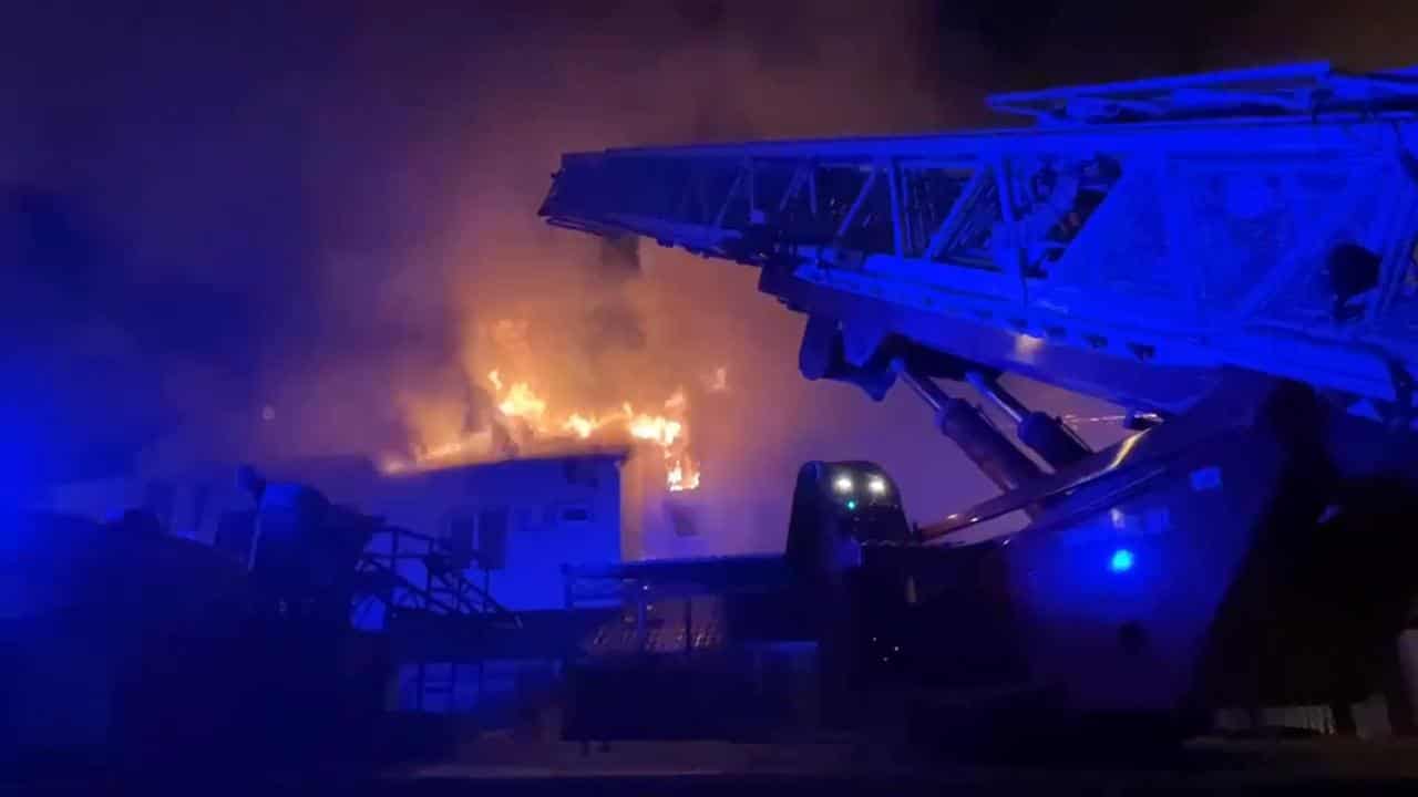 firefighters extinguish fire after a missile attack