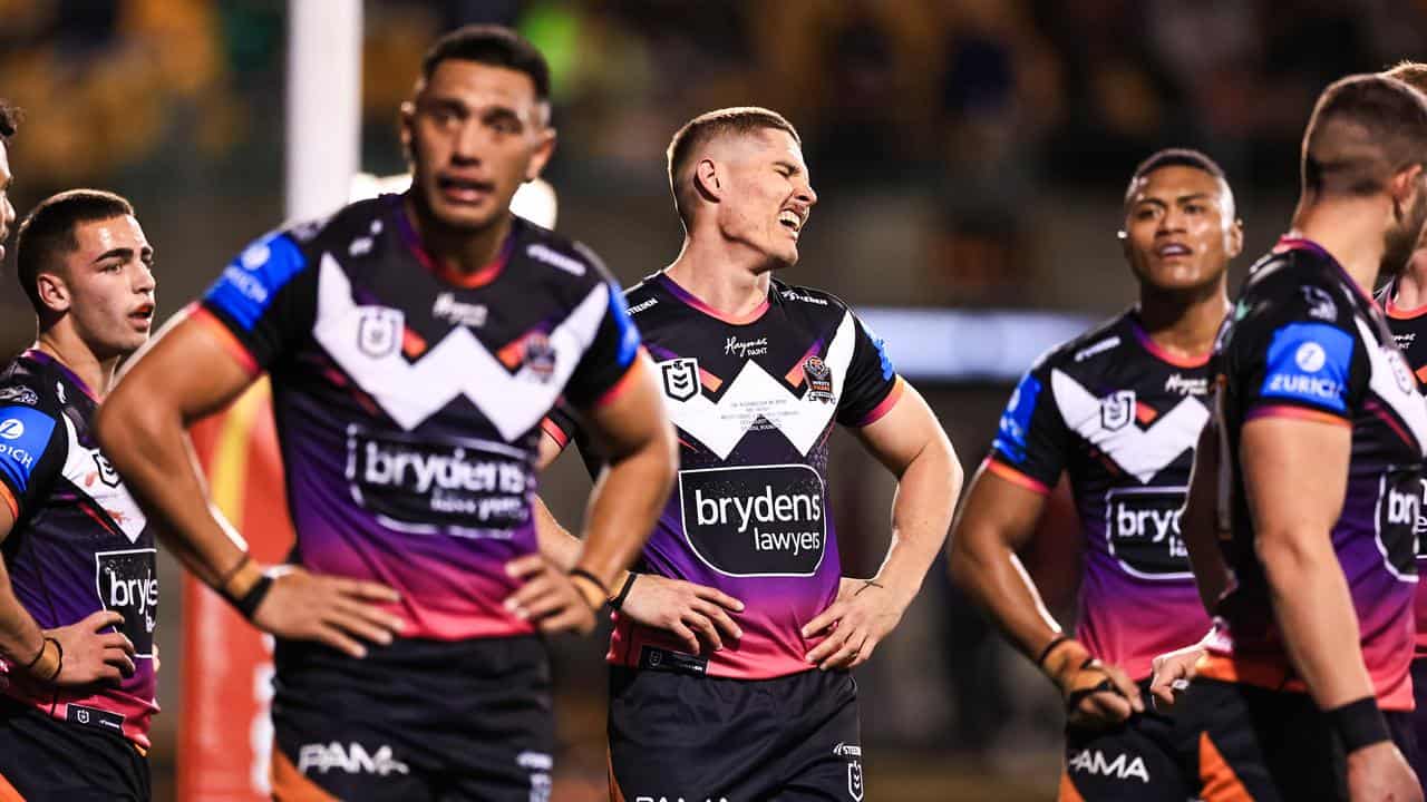 Wests Tigers players looking dejected after a loss.