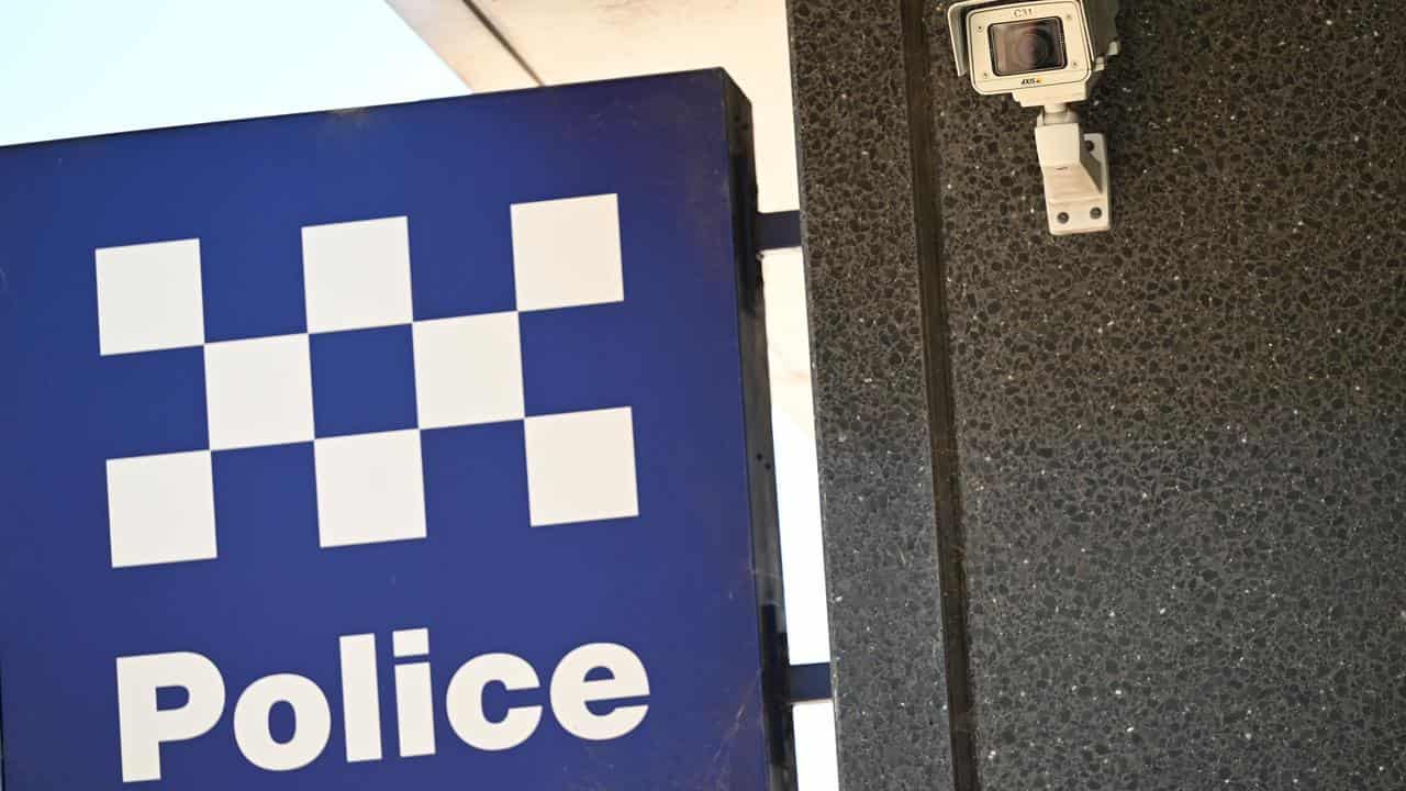 A NSW Police sign and security camera