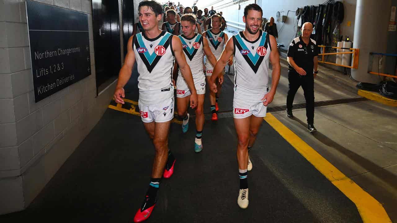 Connor Rozee (left) and former skipper Travis Boak (right).