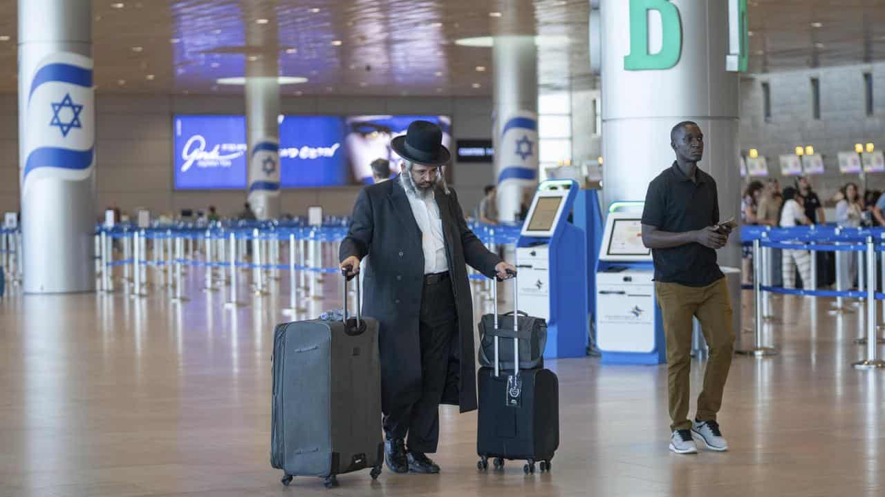 Travellers at Ben Gurion International Airport near Tel Aviv, Israel