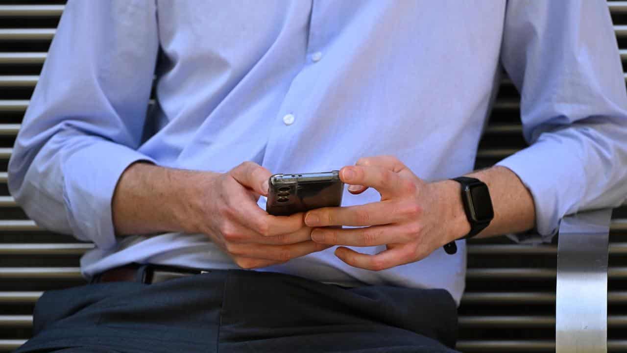 A man using a mobile phone.